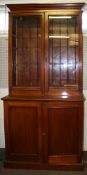 A mahogany glazed bookcase.