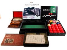 A collection of assorted games. Including Mah Jong, dominoes and a set of snooker balls, etc.