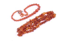 Two amber bead necklaces.