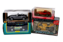 Four diecast model vehicles.