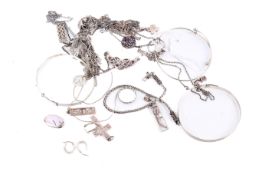 A small group of silver and white metal jewellery.