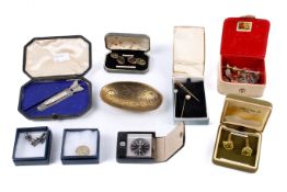 A small collection of tie pins, cufflinks and other items.
