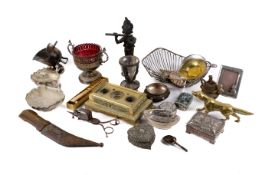 A collection of assorted plated and brass items. Including a brass inkwell, a basket, etc.