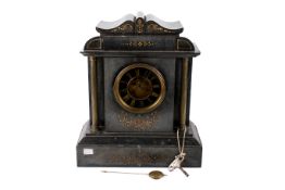 A Victorian black slate mantle clock.