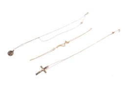 Three chains, including a 9ct gold lion pendant and crucifix.