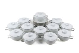 A set of Royal Copenhagen 'Fajance' soup bowls with covers and plates. Max.