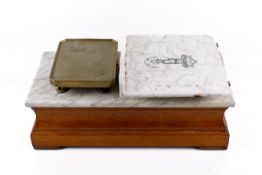 A set of scales. Featuring a ceramic plate on a marble top over an oak base, H25cm.