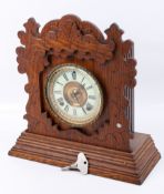 An Ansonia Penton, USA eight day strike oak cased mantel clock.