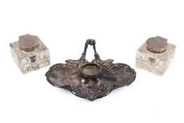 Two sterling silver hallmarked glass inkwells and a plated pen stand.