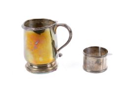 A small silver tankard and a napkin ring.
