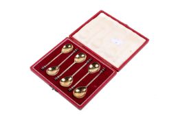 A set of Queen Elizabeth II coronation year silver gilt coffee spoons.