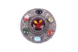 A large Scottish style white metal and stone brooch.