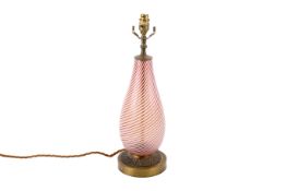 A mid-century red and white striped glass and brass table lamp.