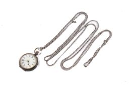 A Victorian lady's fob watch on a white metal long guard chain.