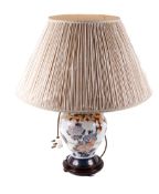 A contemporary Chinese ginger jar table lamp. Raised on a circular hardwood stand. 34cm.
