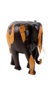 A contemporary carved wooden elephant. With bone tusks, H36cm.