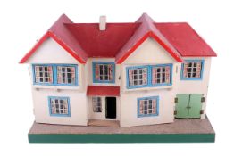 A mid-century Tri-ang dolls house and accessories.