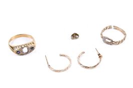 Two gold rings and a pair of earrings.