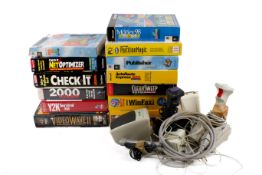 A collection of assorted vintage PC equipment and software instruction CD Roms, etc.