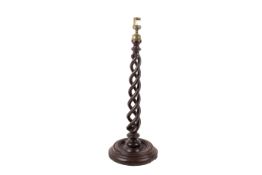 A mahogany triple barley twist lamp base candlestick. With brass finial and circular turned base.