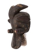 West African tribal carved wood Suaga type mask. With traces of red, white pigment.