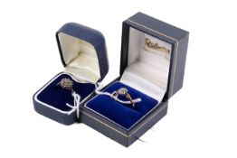 Two stone set rings. One hallmarked 9ct gold cluster set with single cut diamonds of 0.
