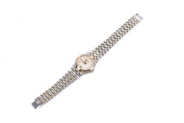 A ladies Gucci stainless steel and gold wristwatch.