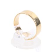 A 14ct gold wedding band. Marked 585, band width 5mm, size L/M, weight 3.2g.