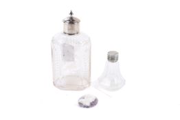 A holy water bottle, a glass tea caddy and a Napoleon plaque.