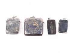 Three Victorian and later silver vesta cases and a silver pendant.