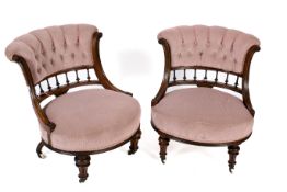 A pair of Victorian mahogany framed button back upholstered bedroom chairs.