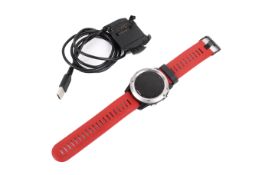 A Garmin Fenix 3 smart watch. With red strap and charger, untested.