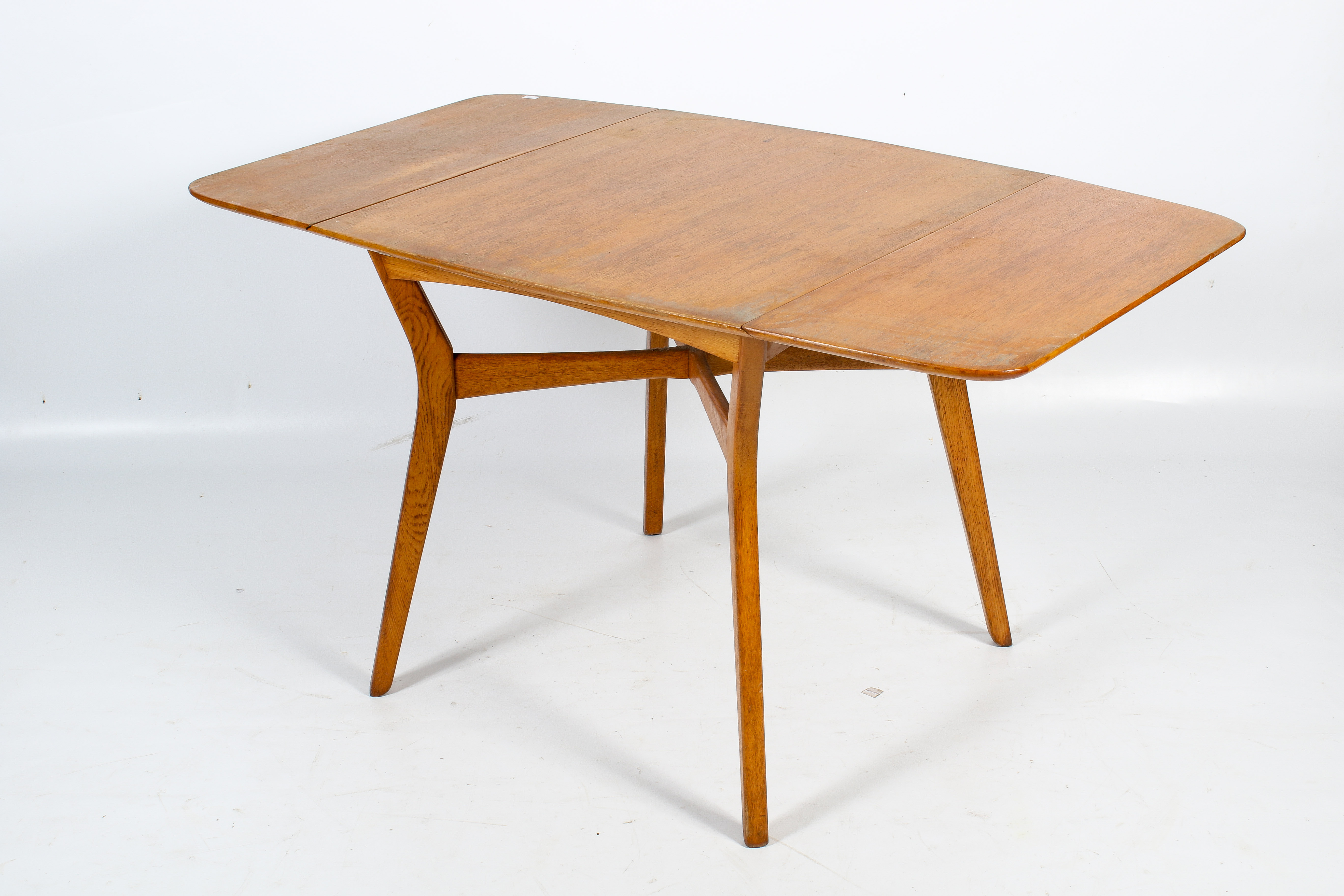 A mid-century G-Plan oak drop leaf table and four chairs by E Gomme. H75cm x W80cm x D138cm (open). - Image 2 of 5