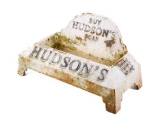 A cast metal 'Hudson's Soap' dog's drinking trough, painted white.