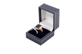 A 9ct signet ring. Set with a black octagonal stone, slightly misshapen band size circa R, weight 3.