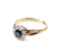 An 18ct sapphire and diamond cluster ring.