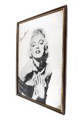 A vintage rectangular wall mirror with Marilyn Monroe. 44cm x 60cm.