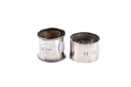 Two silver napkin rings.