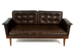 A mid-century leatherette sofa fold out bed.