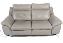 A two-section light grey leather power recliner sofa by motion group #6114. H 93cm W 180cm.