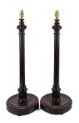 A mid-20th century pair of walnut lamp bases.