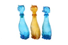 Three mid-century novelty glass bottles. Modelled as two cats and a dog.