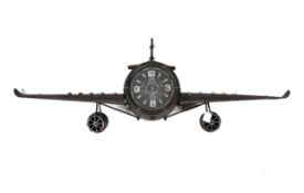 A novelty wall clock in the shape of an aeroplane.