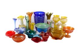 Collection of assorted coloured glassware items. Including a blue cut glass vase, etc. Max.