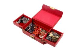 A small collection of assorted costume jewellery in a red jewellery box.