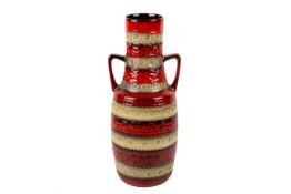 A two handled red and brown West German vase