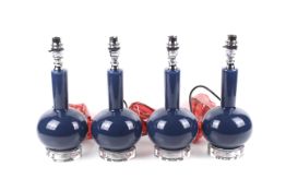 A set of four India Jane blue glass table lamps.