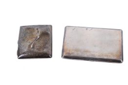 Two silver cigarette cases.