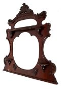 An overmantel mahogany framed mirror.