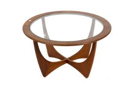 A mid-century G Plan (red label) 'Astro' teak circular glass top coffee table.
